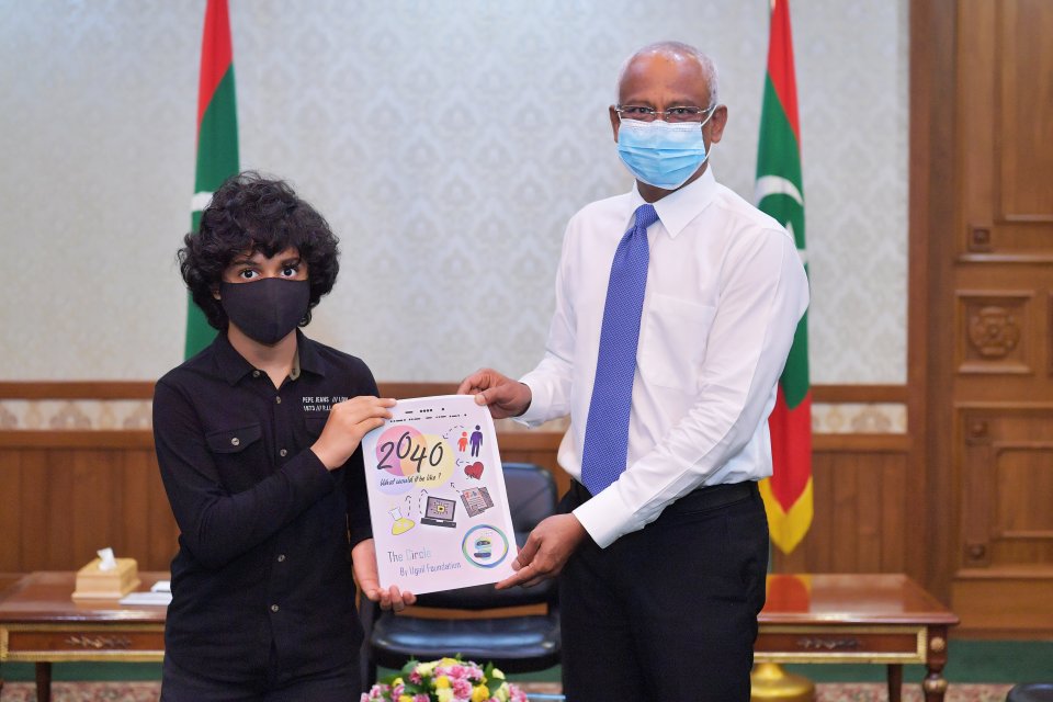 President presented with two books authored by Chidren