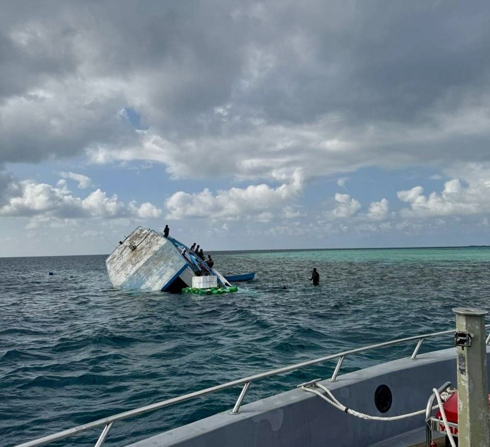 A ships carrying goods runs aground on a reef in Vaavu Atoll