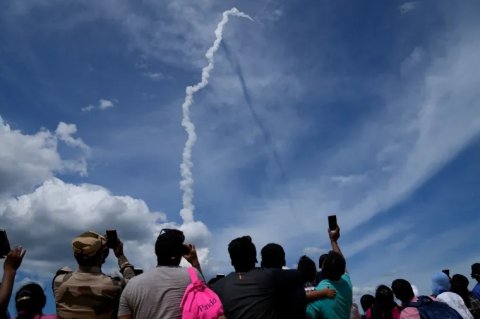 India launches rocket to land spacecraft on moon
