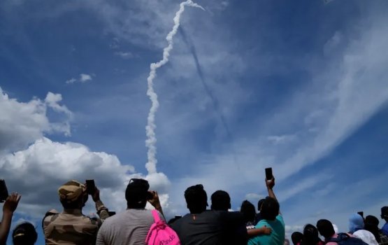 India launches rocket to land spacecraft on moon